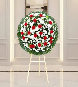 Corona de flores para difuntos en diseño elegante con entrega a domicilio en CDMX.