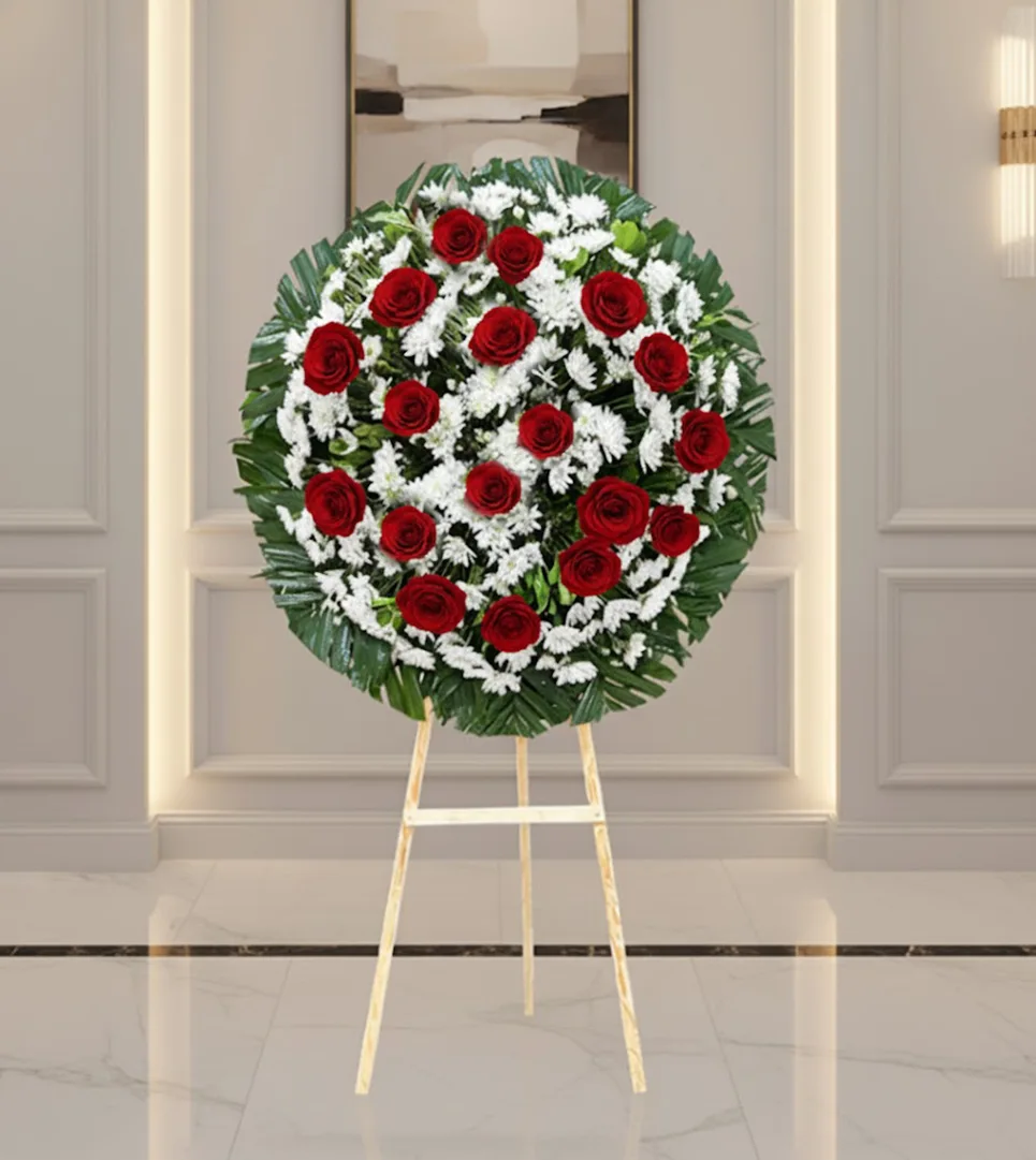Corona para difuntos con flores frescas en diseño fúnebre elegante